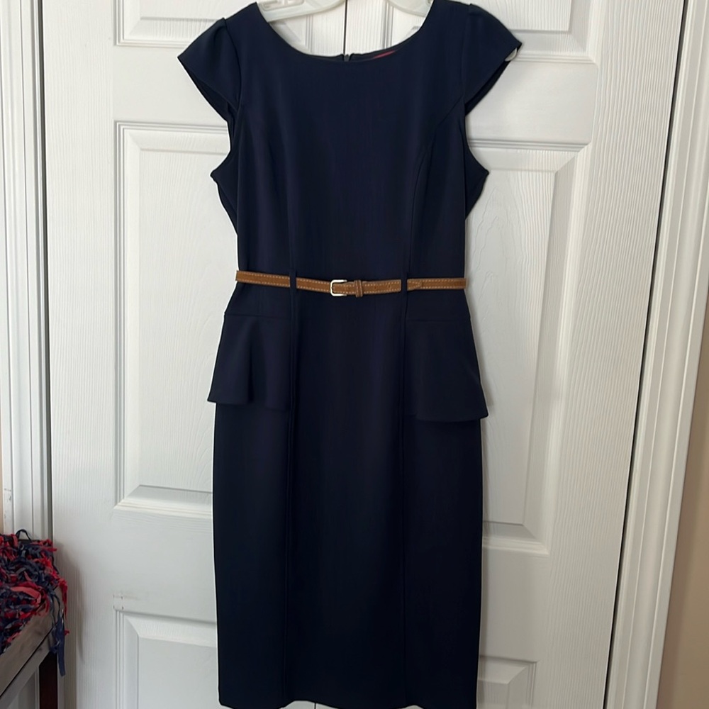 Navy dress. Belt loops. Skirted sides.